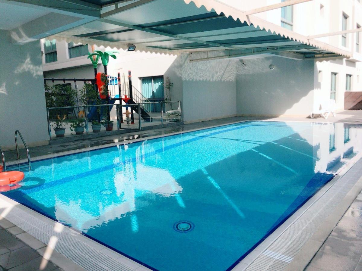 Stout Apartments Manama Phòng bức ảnh