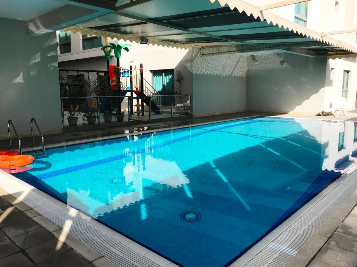 Stout Apartments Manama Phòng bức ảnh